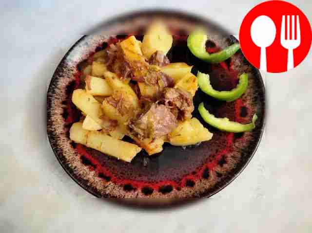 Hearty potatoes with pickles and stew