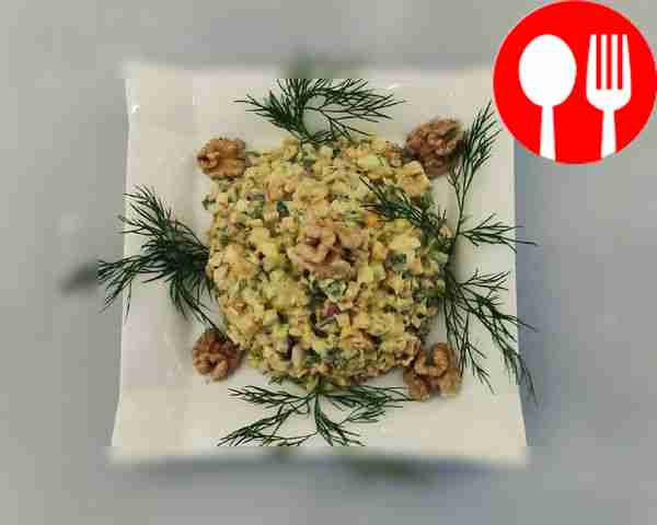 Mosaic salad of crab sticks with walnuts