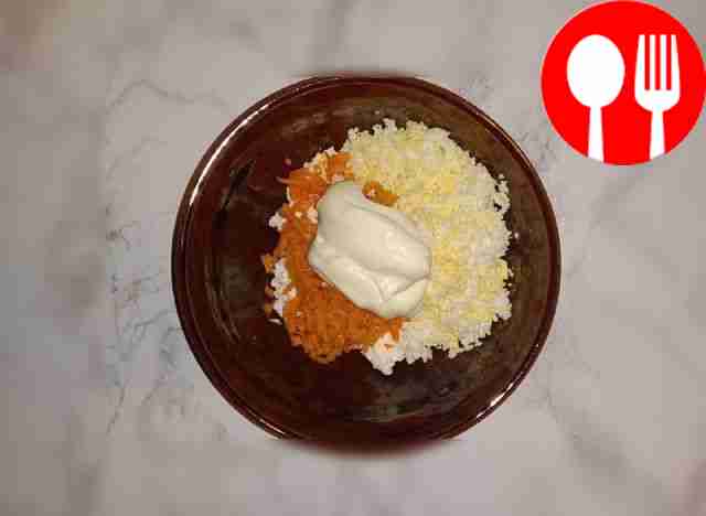 Grate the eggs and frozen processed cheese on...