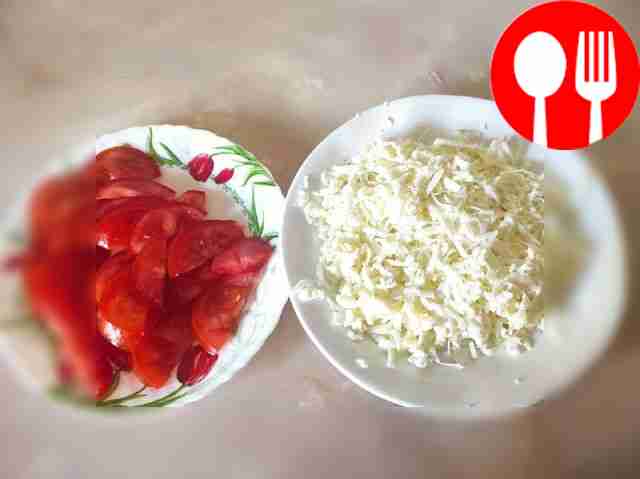 Cut the tomatoes into half rings. Grate the...