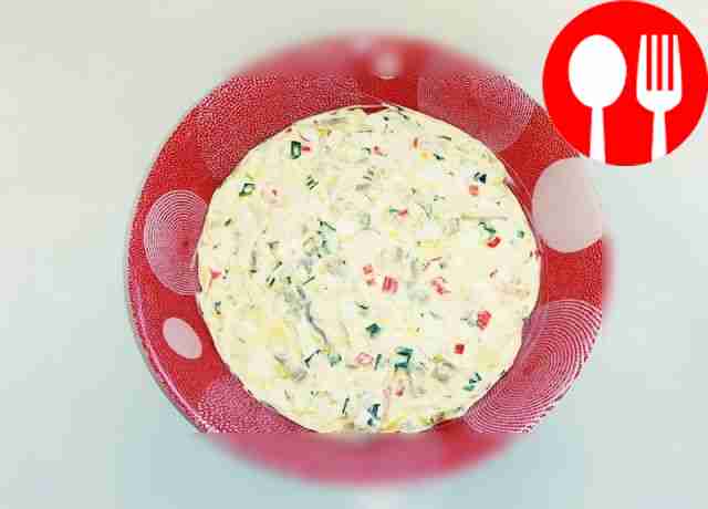 Delicious salad of crab sticks, squid, mushrooms and pineapples