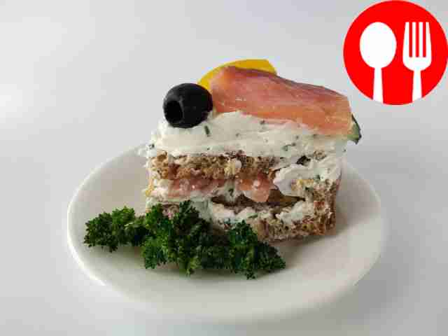 Festive sandwich cake with red fish