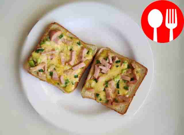 Hot sandwiches with sausages in a frying pan