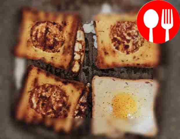 Once the egg is slightly fried, turn the toast...