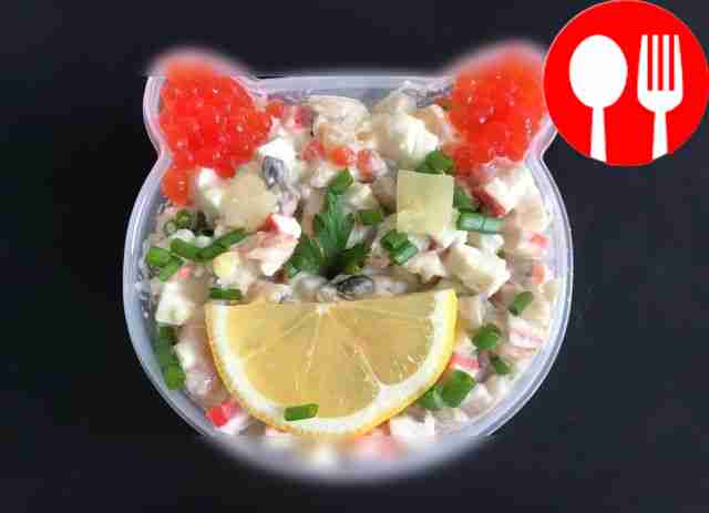 Delicious salad with shrimp, red caviar and champignons