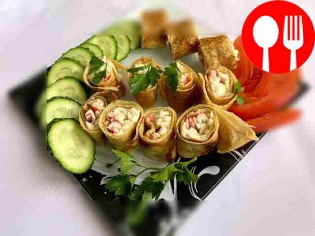 Pancakes with crab sticks and eggs