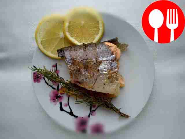 Baked trout with rosemary sprigs