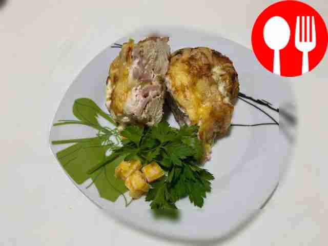 Baked chicken breast with cheese and ham