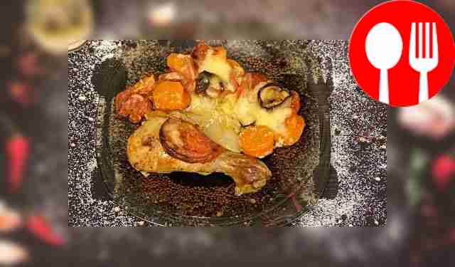 Serve chicken legs baked with vegetables,...