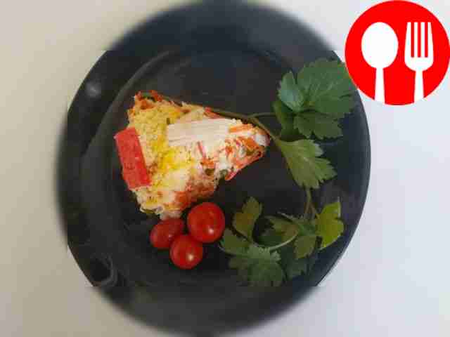 Layered salad with crab sticks