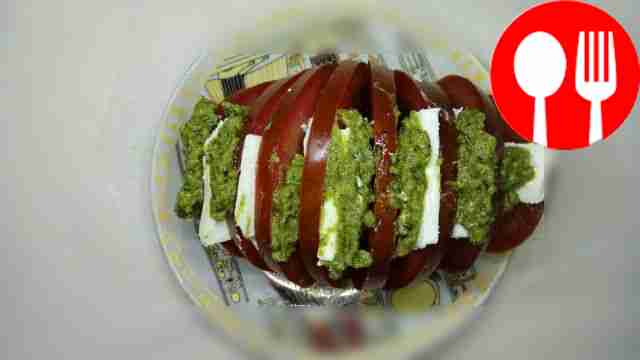 Unusual Caprese with feta cheese and pesto sauce