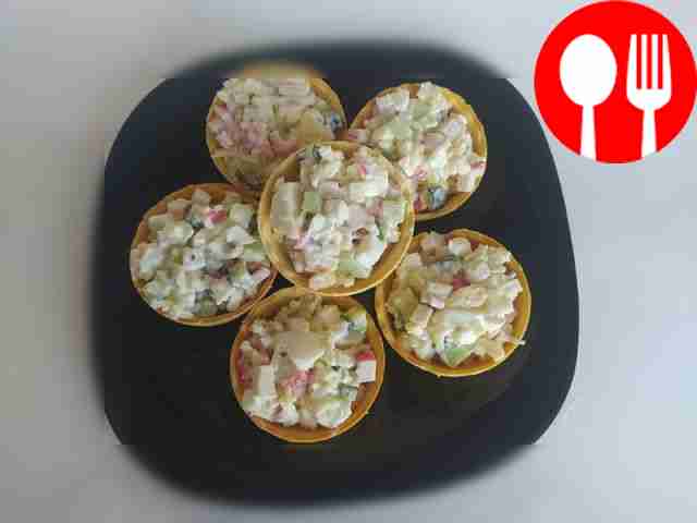 Crab stick salad in tartlets