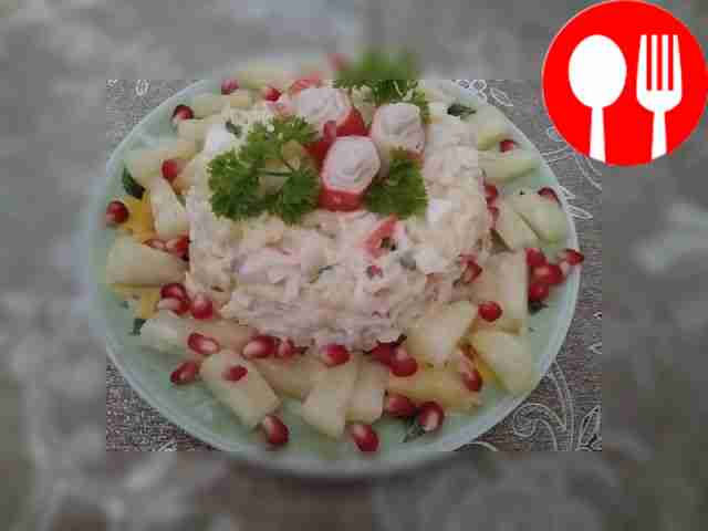 Salad with crab sticks and pineapples
