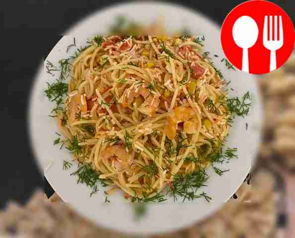 Pasta in creamy sauce with crab sticks