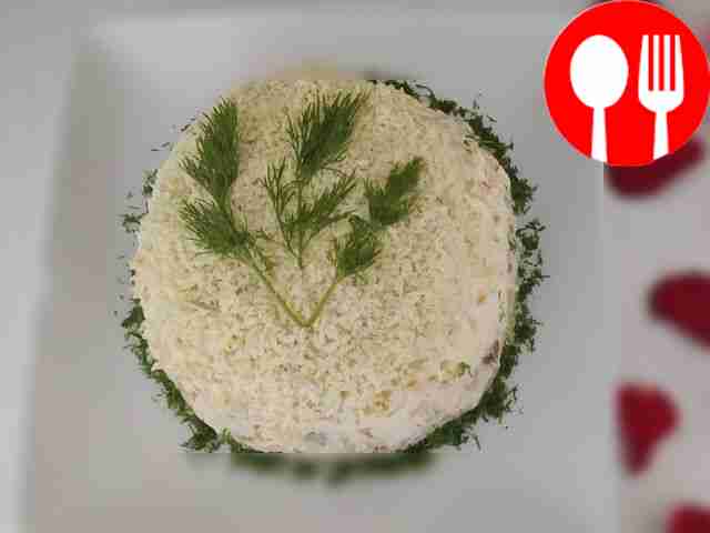 Mimosa salad made from potatoes and chicken eggs, dressed with mayonnaise