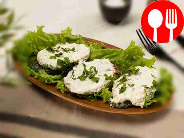 Fried zucchini with cottage cheese and herbs