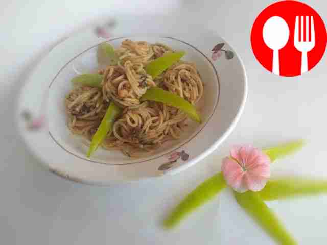 Homemade pasta with canned fish and herbs