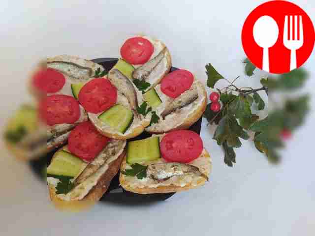 Toasts with canned sprats and parsley