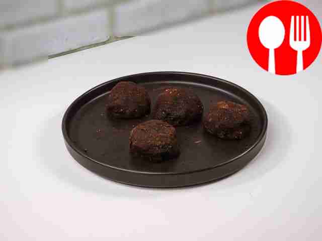 Dip the brownies in cocoa powder and place...