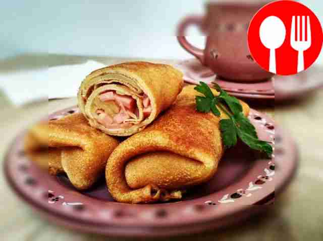 Appetizing pancakes with sausage, fried in batter
