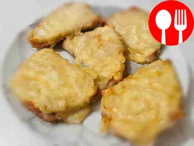 Pork under a cheese shawl in the oven