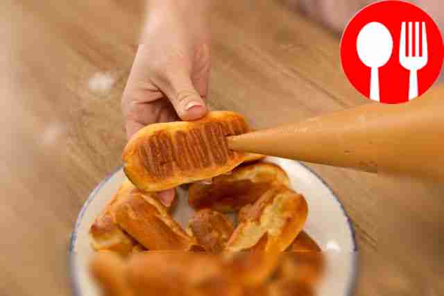 Cool the eclairs. Make two small holes at the...