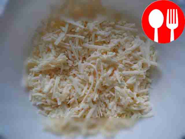 Grate the cheese on a coarse grater.