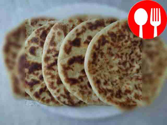 Flatbread with cheese in a frying pan