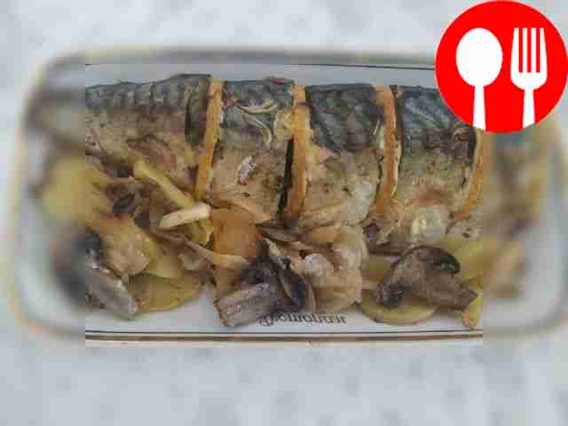 Delicious mackerel in lemon juice with potatoes and mushrooms