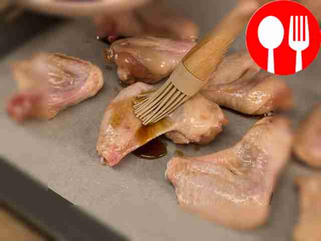 Place the prepared wings on a baking sheet and...