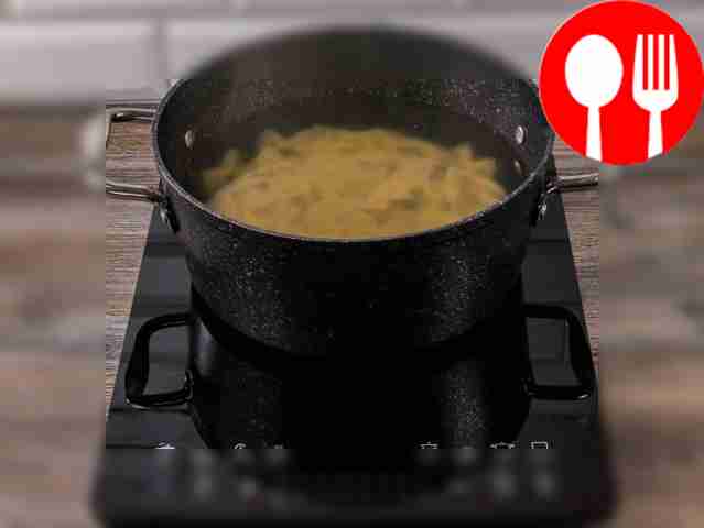 When the water in a large saucepan comes to a...