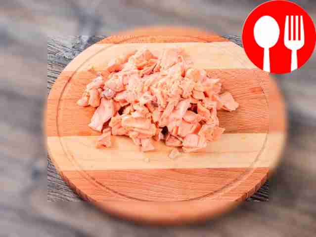 Cool the boiled fish slightly and separate the...