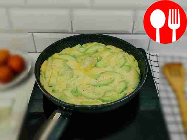 Remove the lid and let the omelette brown.