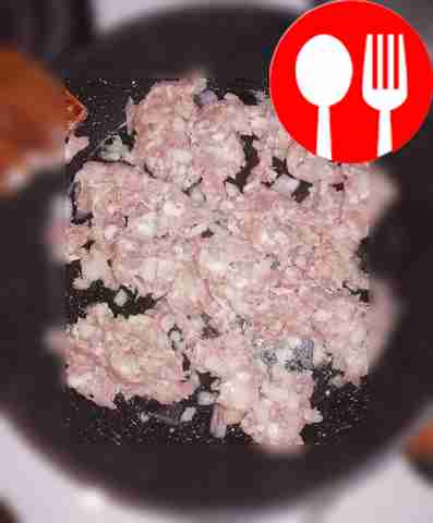 Fry the minced meat with onions in vegetable...