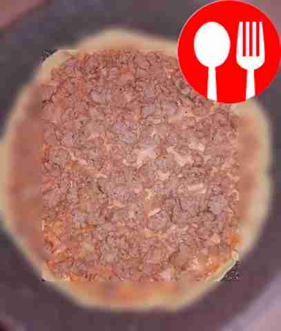 Place the minced meat on the dough, then the...