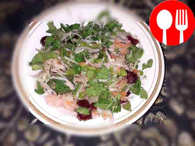 Vitamin salad of sauerkraut with parsley and cranberries