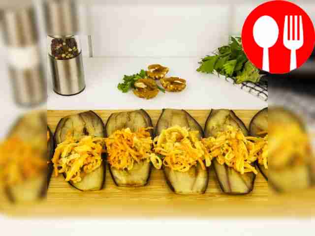 Place the fried eggplant slices in front of...