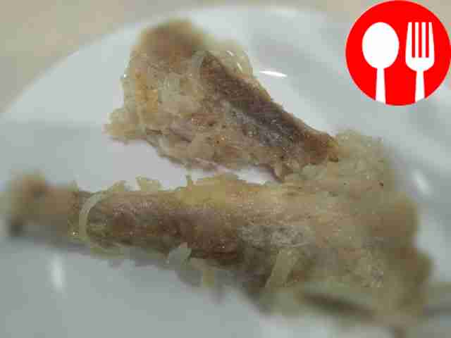 Fried pollock with onions