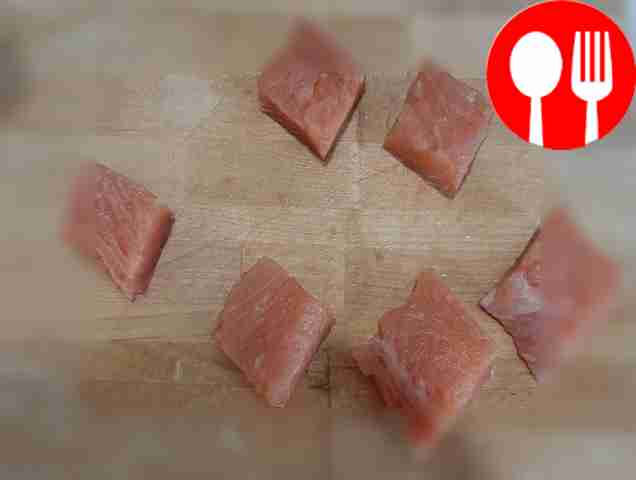 Cut clean pink salmon fillet into medium...