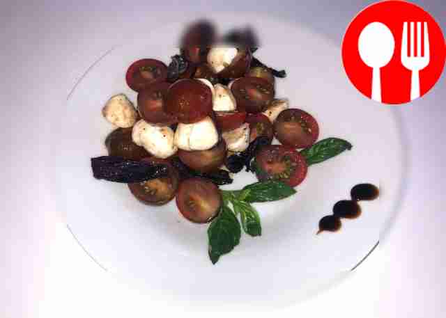 Caprese salad with cherry tomatoes and mini mozzarella