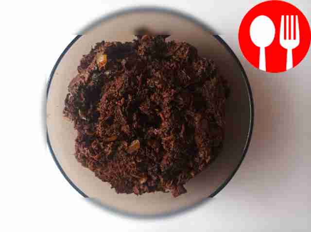 Spread caviar on bread. Sprinkle herbs on top.