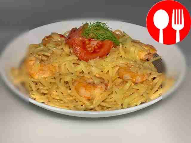 Pasta in creamy sauce with shrimp