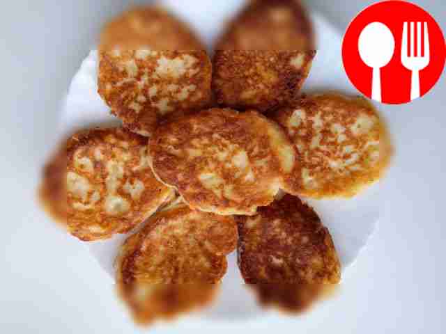 Homemade pancakes with hard cheese and feta cheese