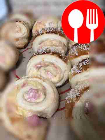 Homemade puff pastries with ham and cheese