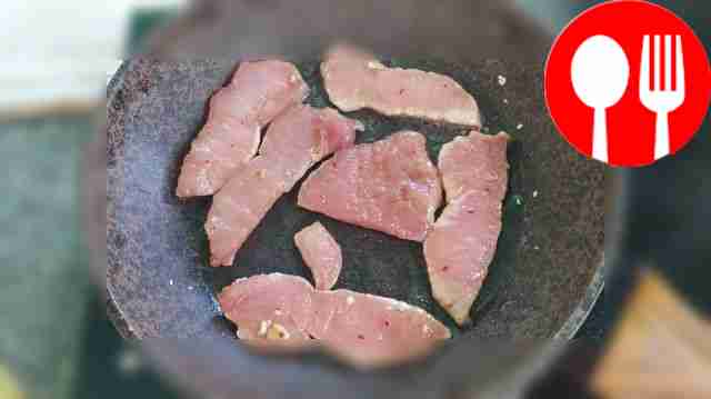 Fry the pork slices in hot vegetable oil for 3...