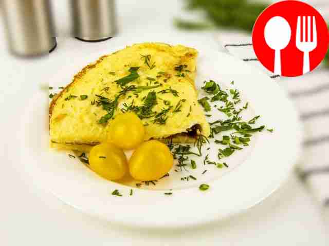 Transfer the omelet to a plate and serve with...