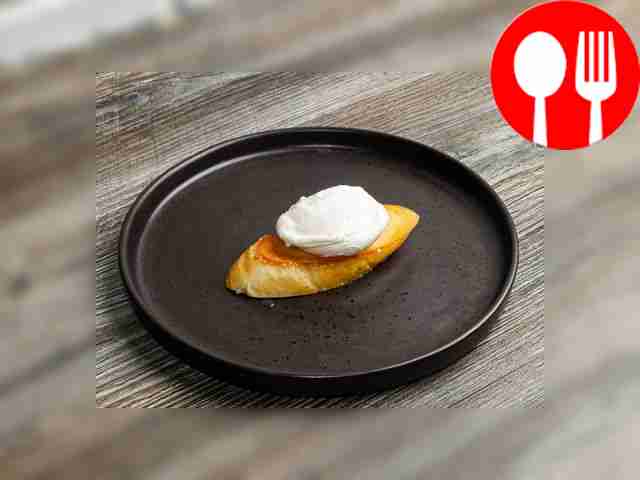 Place the finished poached egg on wheat bread toast.