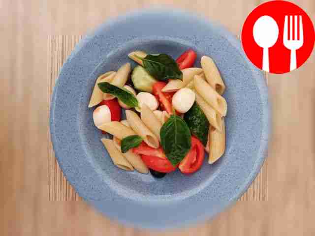 Italian salad with pasta and basil