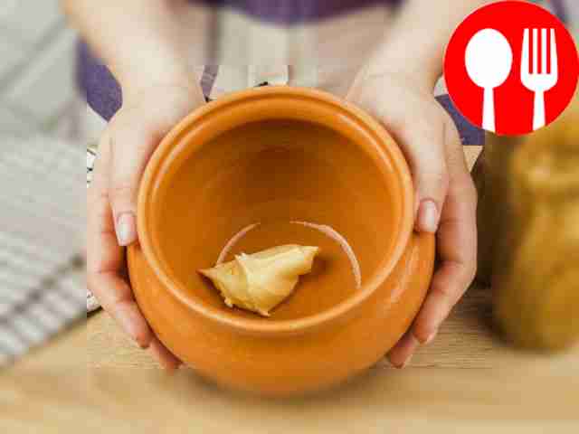 Place butter on the bottom of the clay pot.