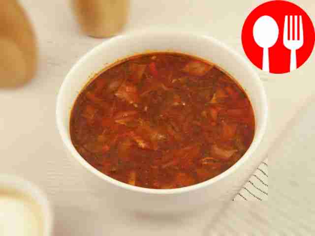 Serve Kuban borscht with sour cream, fresh...